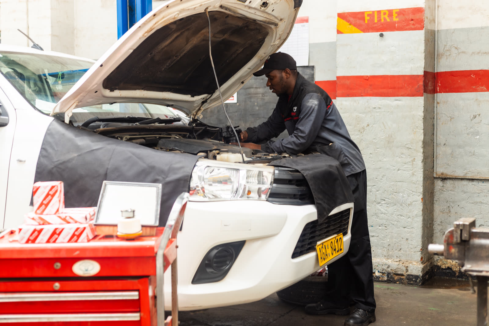 A Toyota-trained technician servicing a vehicle at Gweru Toyota